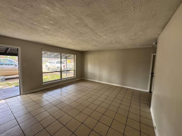 3508 N Robison Rd, Texarkana, TX 75501 - tiled spare room with plenty of natural light, baseboards, and a textured ceiling