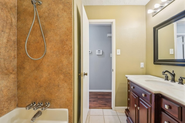 full bathroom featuring vanity, baseboards, tile patterned flooring, and bathtub / shower combination