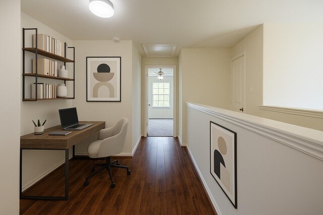 home office with baseboards, attic access, and dark wood-type flooring
