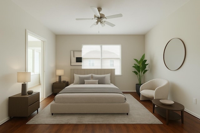 bedroom with baseboards, ceiling fan, and wood finished floors