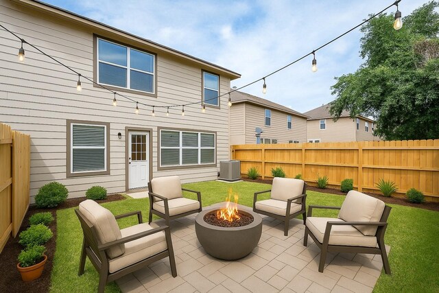 back of house featuring fence, a patio area, and an outdoor fire pit
