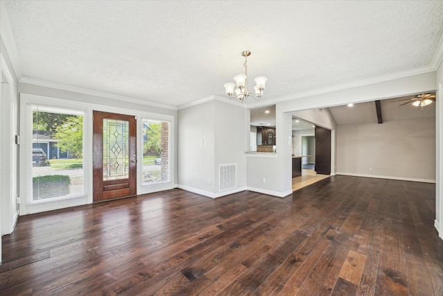unfurnished living room with a chandelier, dark wood-type flooring, baseboards, a textured ceiling, and ornamental molding