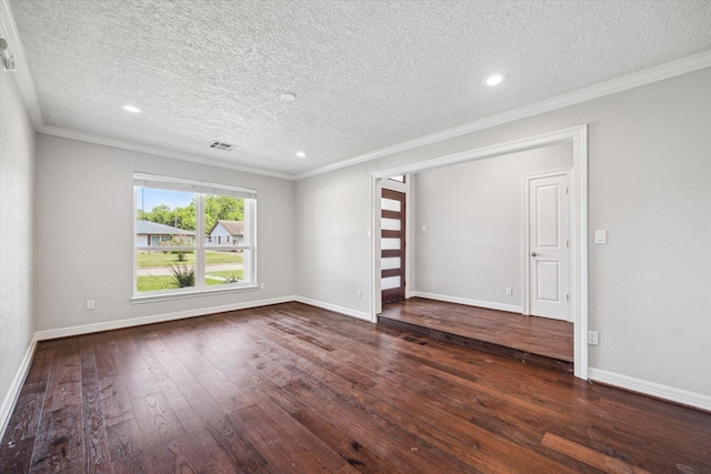 empty room featuring crown molding, wood-type flooring, a textured ceiling, baseboards, and recessed lighting