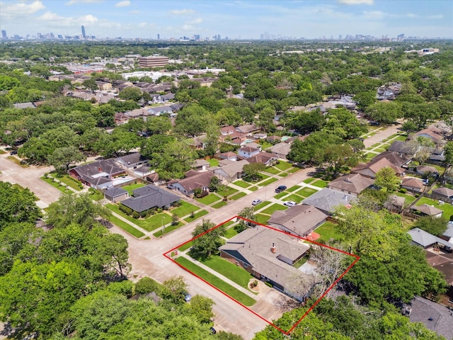 aerial view of residential area featuring property parcel outlined and a skyline view