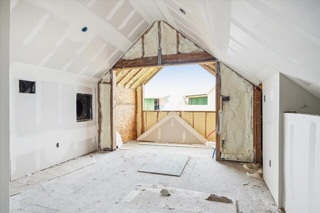 additional living space featuring vaulted ceiling