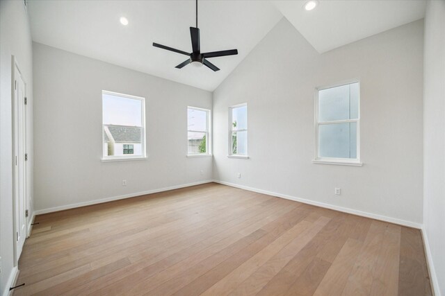 empty room with recessed lighting, light wood finished floors, a ceiling fan, and baseboards