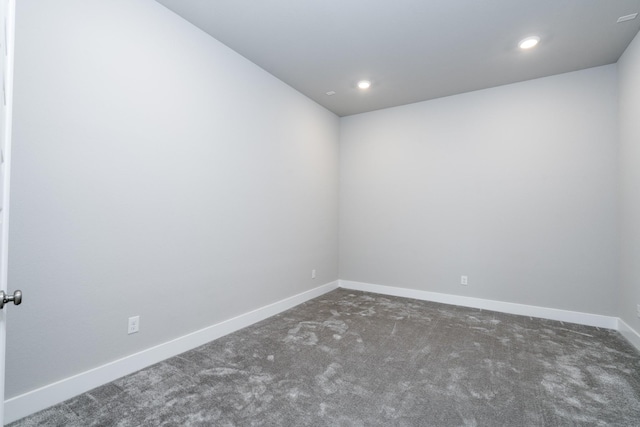 carpeted empty room with baseboards and recessed lighting