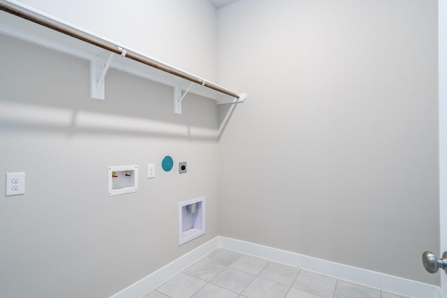 laundry room with hookup for a washing machine, hookup for an electric dryer, light tile patterned floors, baseboards, and laundry area