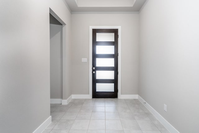 entrance foyer featuring baseboards and light tile patterned floors