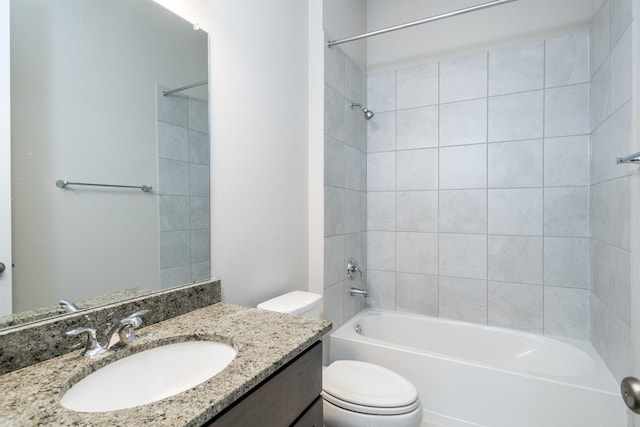 full bath with toilet, vanity, and  shower combination