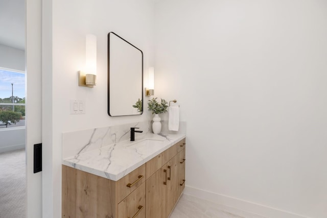 bathroom featuring vanity and baseboards