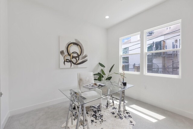office space with baseboards and carpet