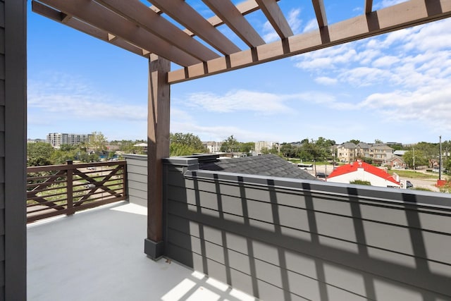 balcony featuring a pergola