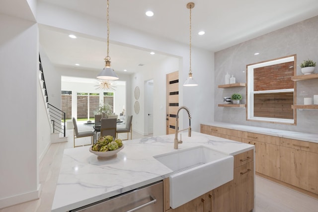 kitchen with stainless steel dishwasher, light brown cabinetry, open shelves, and a sink