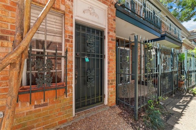 3400 Timmons Ln Unit 68, Houston, TX 77027 - view of exterior entry featuring brick siding