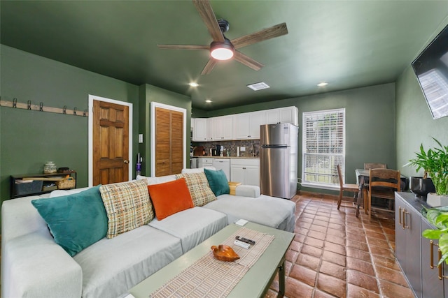3400 Timmons Ln Unit 68, Houston, TX 77027 - tiled living area featuring a ceiling fan, plenty of natural light, and recessed lighting