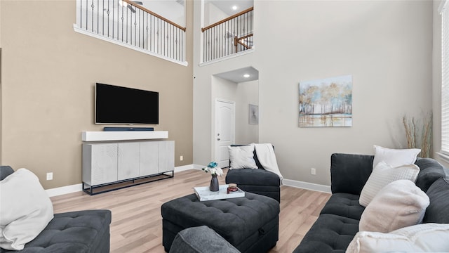 119 Buckeye Dr, Montgomery, TX 77316 - living room with a towering ceiling, wood finished floors, and baseboards