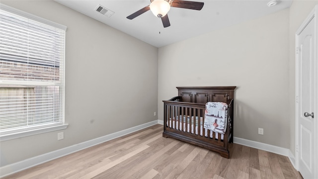 119 Buckeye Dr, Montgomery, TX 77316 - bedroom with light wood finished floors, baseboards, visible vents, and multiple windows