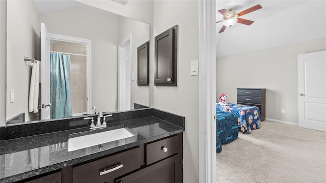119 Buckeye Dr, Montgomery, TX 77316 - bathroom with vaulted ceiling, vanity, ceiling fan, and a shower with shower curtain