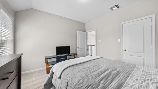 119 Buckeye Dr, Montgomery, TX 77316 - bedroom with vaulted ceiling, visible vents, baseboards, and carpet floors
