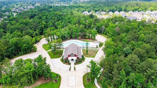 119 Buckeye Dr, Montgomery, TX 77316 - aerial view featuring a wooded view