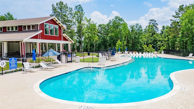 119 Buckeye Dr, Montgomery, TX 77316 - pool with fence and a patio