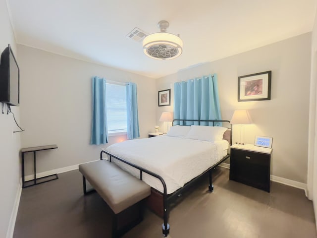 bedroom featuring baseboards and visible vents