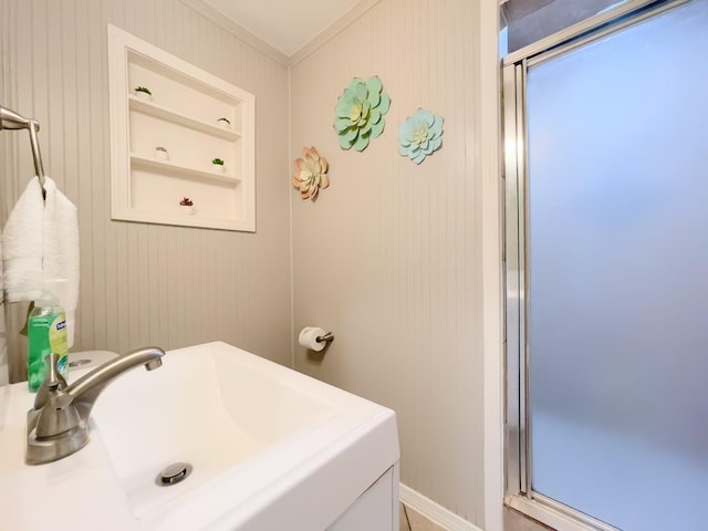 8423 Glen Valley Dr, Houston, TX 77061 - full bathroom with a sink, crown molding, a shower stall, and built in features