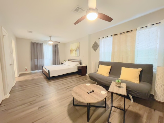 8423 Glen Valley Dr, Houston, TX 77061 - bedroom featuring wood finished floors, ceiling fan, and baseboards