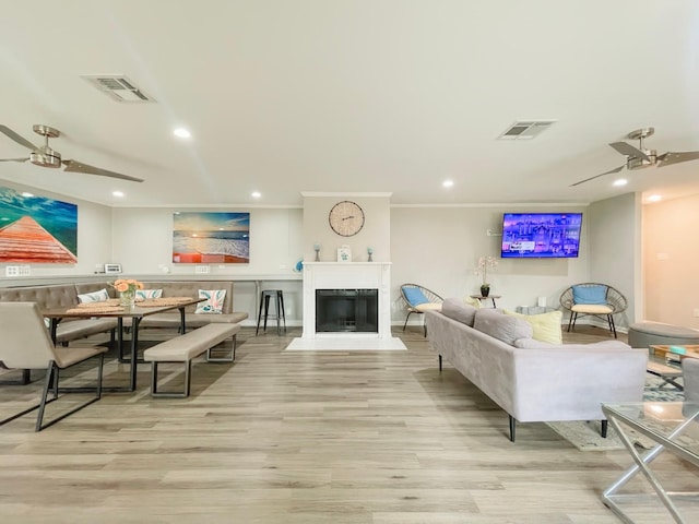 8423 Glen Valley Dr, Houston, TX 77061 - living area with a ceiling fan, wood finished floors, recessed lighting, a fireplace with flush hearth, and baseboards