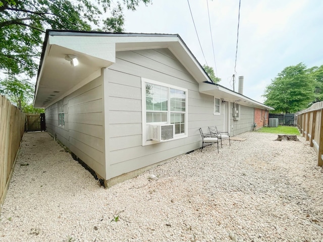 8423 Glen Valley Dr, Houston, TX 77061 - back of house featuring a fenced backyard, cooling unit, and central AC unit