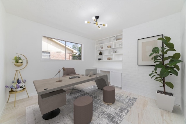 home office with built in shelves and a notable chandelier