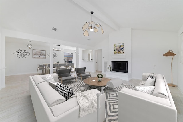 living area with beamed ceiling, baseboards, visible vents, a notable chandelier, and high vaulted ceiling