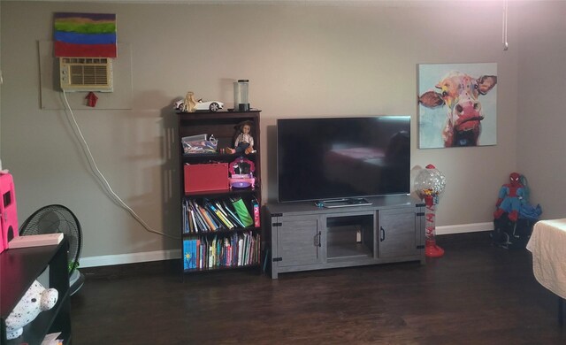bedroom featuring baseboards and wood finished floors