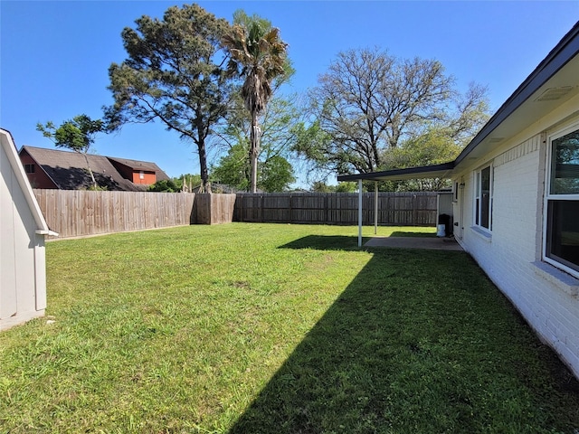 view of yard featuring a fenced backyard