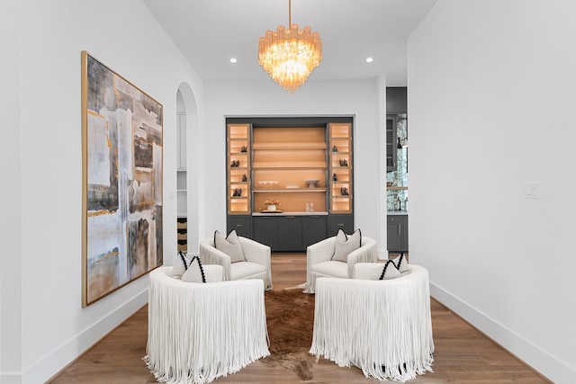 216 W 31st St, Houston, TX 77018 - sitting room with arched walkways, wood finished floors, a chandelier, baseboards, and recessed lighting