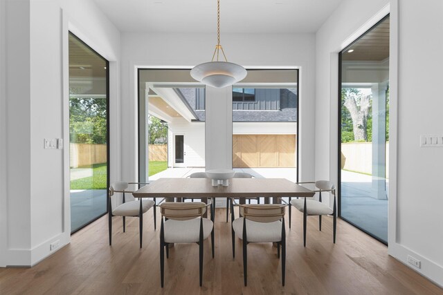 216 W 31st St, Houston, TX 77018 - dining area with wood finished floors and baseboards