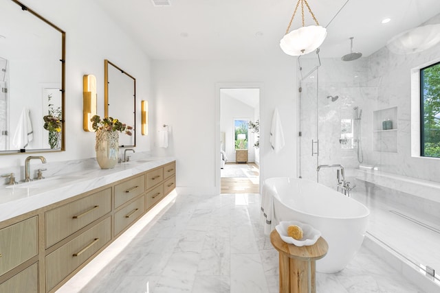 216 W 31st St, Houston, TX 77018 - bathroom featuring a marble finish shower, marble finish floors, a freestanding tub, double vanity, and recessed lighting