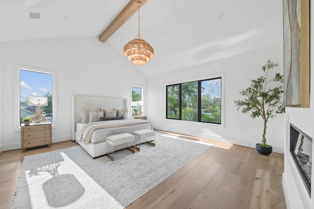 216 W 31st St, Houston, TX 77018 - bedroom featuring light wood-type flooring, a chandelier, and baseboards
