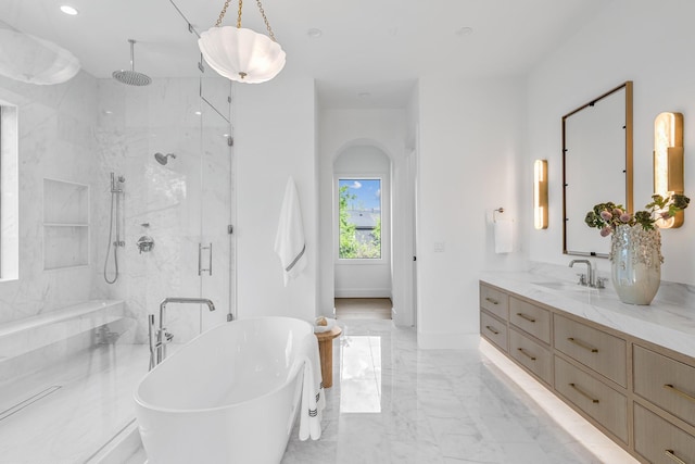 216 W 31st St, Houston, TX 77018 - bathroom with a marble finish shower, marble tiled floors, a soaking tub, vanity, and recessed lighting
