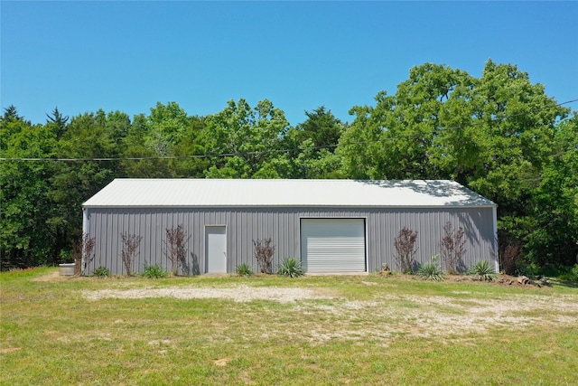 view of pole building with a yard