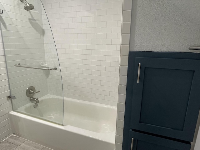 full bathroom with a textured wall, bathing tub / shower combination, and tile patterned flooring