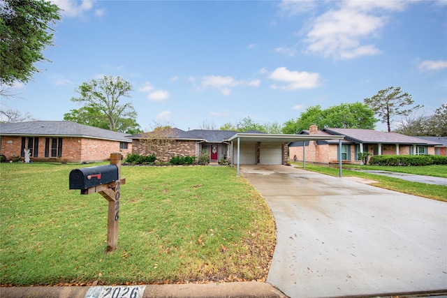 ranch-style house featuring driveway, a carport, an attached garage, a front yard, and brick siding