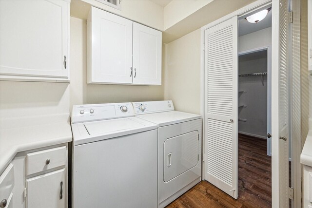 351 N Post Oak Ln Unit 617, Houston, TX 77024 - laundry room featuring dark wood finished floors, cabinet space, and independent washer and dryer