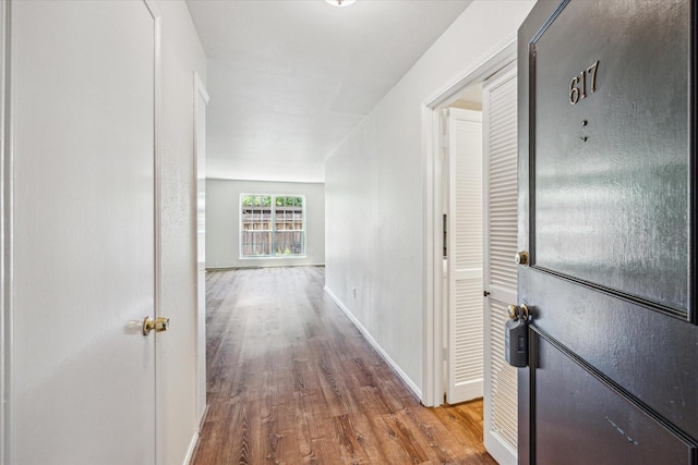 351 N Post Oak Ln Unit 617, Houston, TX 77024 - hall with wood finished floors and baseboards
