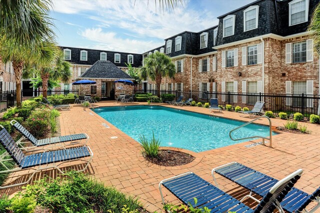 351 N Post Oak Ln Unit 617, Houston, TX 77024 - pool featuring fence and a patio area