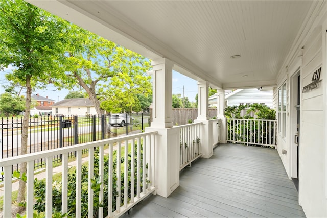 deck with fence and a residential view