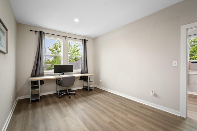 office with baseboards and wood finished floors