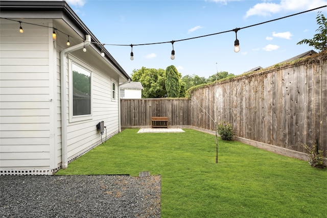 view of yard with a fenced backyard
