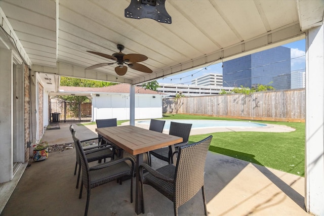 view of patio / terrace with ceiling fan, outdoor dining area, and a fenced backyard